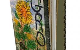 Handmade journal with sunflowers on the cover and the word "Grow".