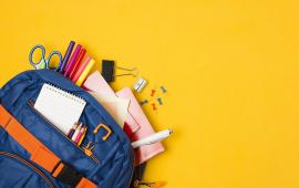 Blue backpack filled with school supplies