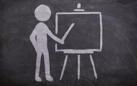 Chalk outline of person presenting on an easel.
