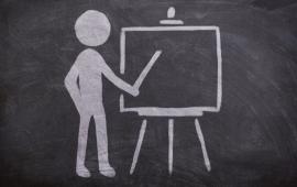 Chalk image of teacher and easel.
