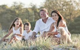 Family sitting together on grass