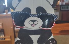 A cardboard panda glasses holder.