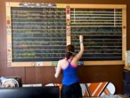 Woman writing on a chalkboard