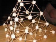 Pyramid made out of toothpicks and marshmallows.