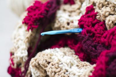Crochet hook sticking out of blanket