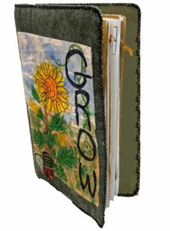 Handmade journal with sunflowers on the cover and the word "Grow".