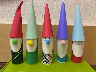 Small gnome figurines lined up in a row