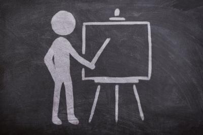 Chalk image of teacher and easel.