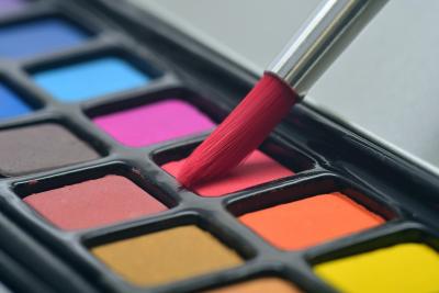 Watercolor paints and a paint brush