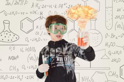 Kid conducting an experiment.
