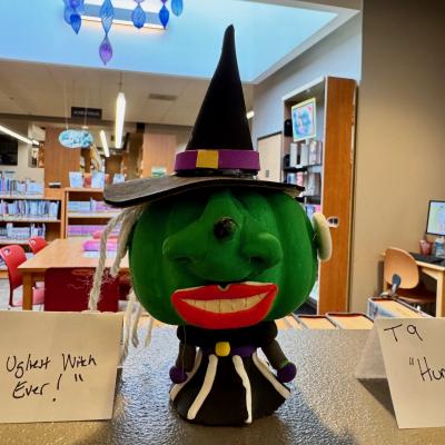 Pumpkin decorated like a witch.
