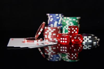 Poker chips, playing cards, and dice.